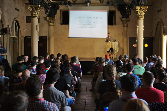 Conference's attendees listening to a speaker
